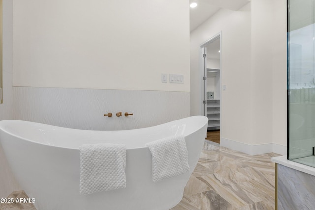 bathroom featuring a washtub