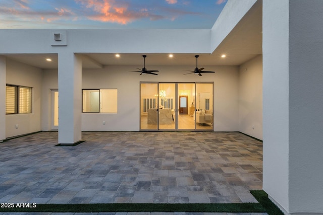 exterior space featuring ceiling fan