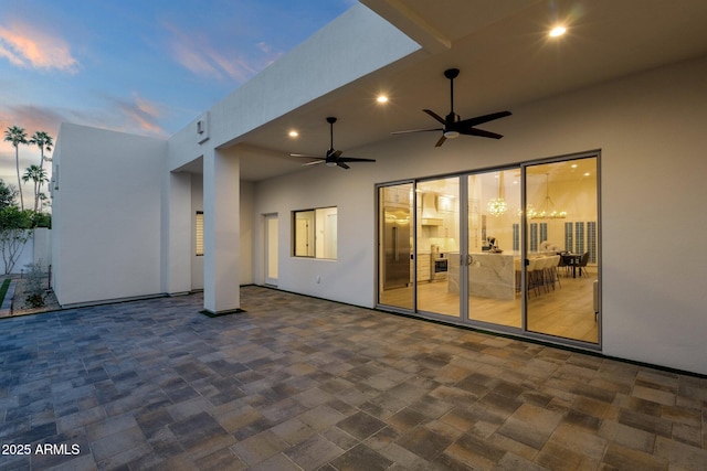 patio terrace at dusk with ceiling fan