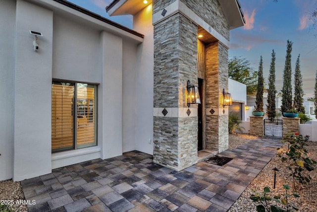 view of patio terrace at dusk