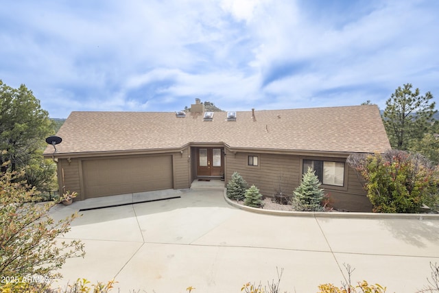 125 Partridge Ln, Prescott, AZ 86303 - view of front of property featuring a shingled roof, an attached garage, a chimney, french doors, and driveway