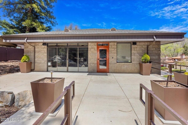 125 Partridge Ln, Prescott, AZ 86303 - rear view of house featuring an outdoor fire pit, a patio area, and stone siding