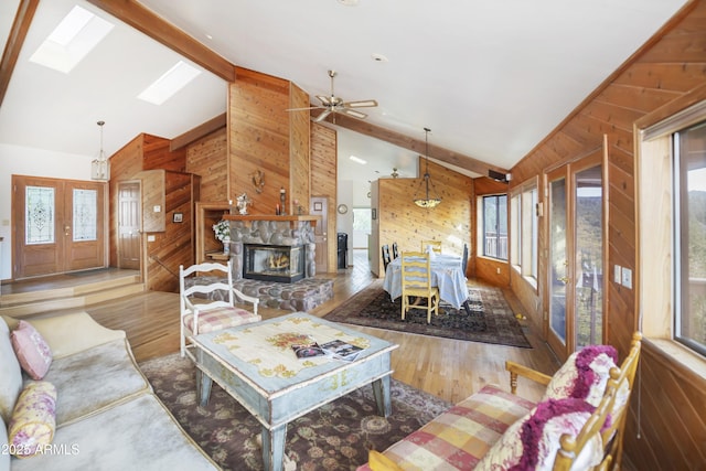 125 Partridge Ln, Prescott, AZ 86303 - living room featuring a skylight, wood walls, and a wealth of natural light