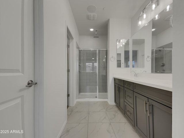 full bathroom with baseboards, marble finish floor, a stall shower, and vanity