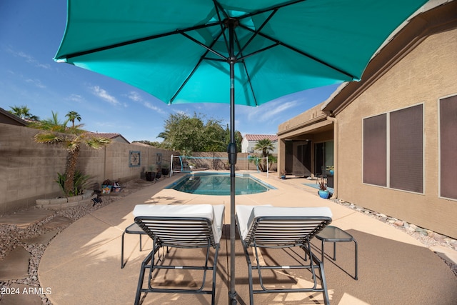 view of swimming pool featuring a patio area