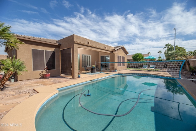 view of swimming pool with a patio area