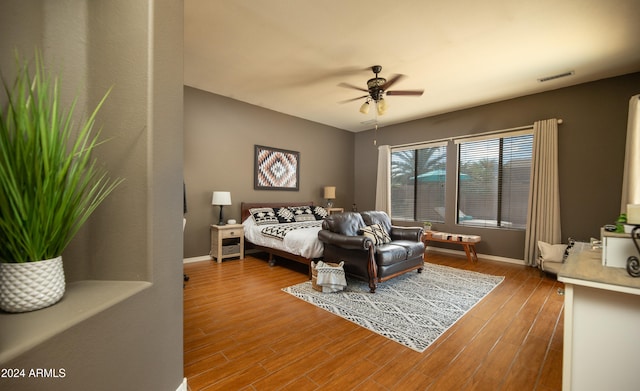 bedroom featuring ceiling fan and hardwood / wood-style floors