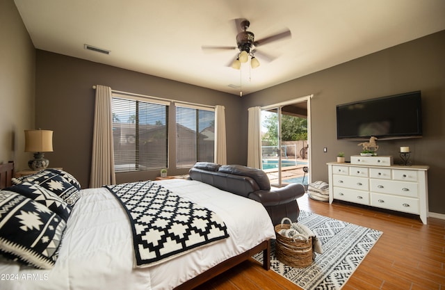 bedroom with access to exterior, ceiling fan, and light hardwood / wood-style flooring