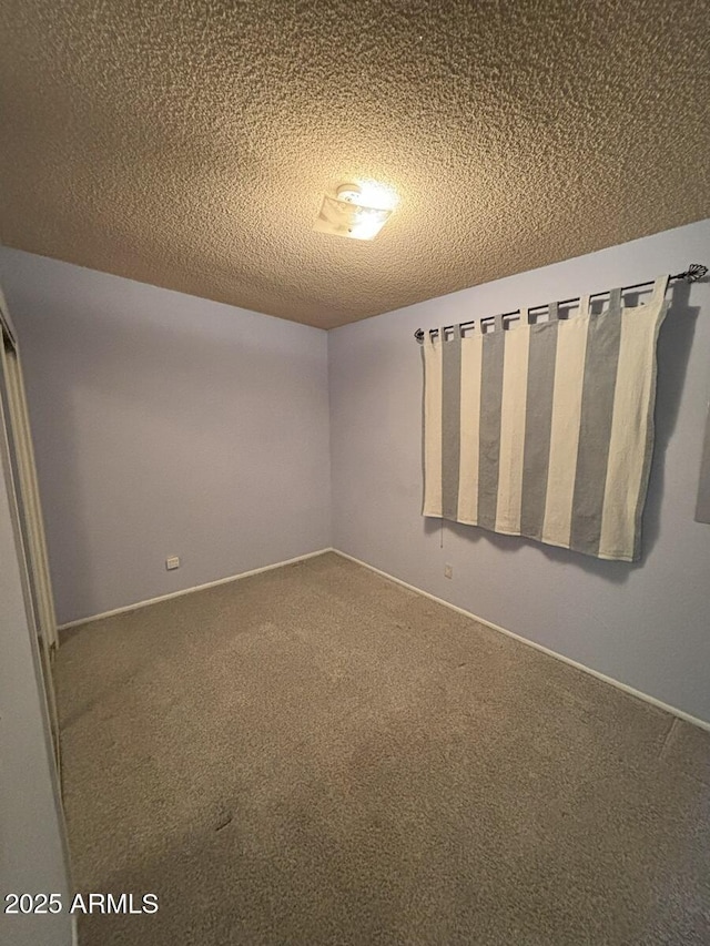 4910 E Foothills Dr, Sierra Vista, AZ 85635 - carpeted empty room with a textured ceiling and baseboards