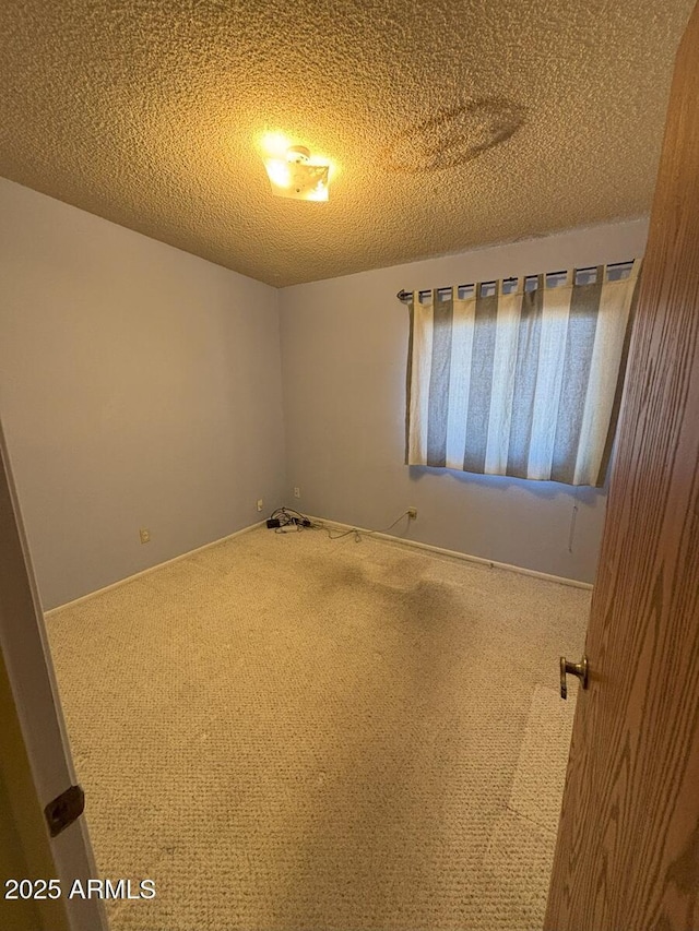 4910 E Foothills Dr, Sierra Vista, AZ 85635 - empty room with carpet floors and a textured ceiling