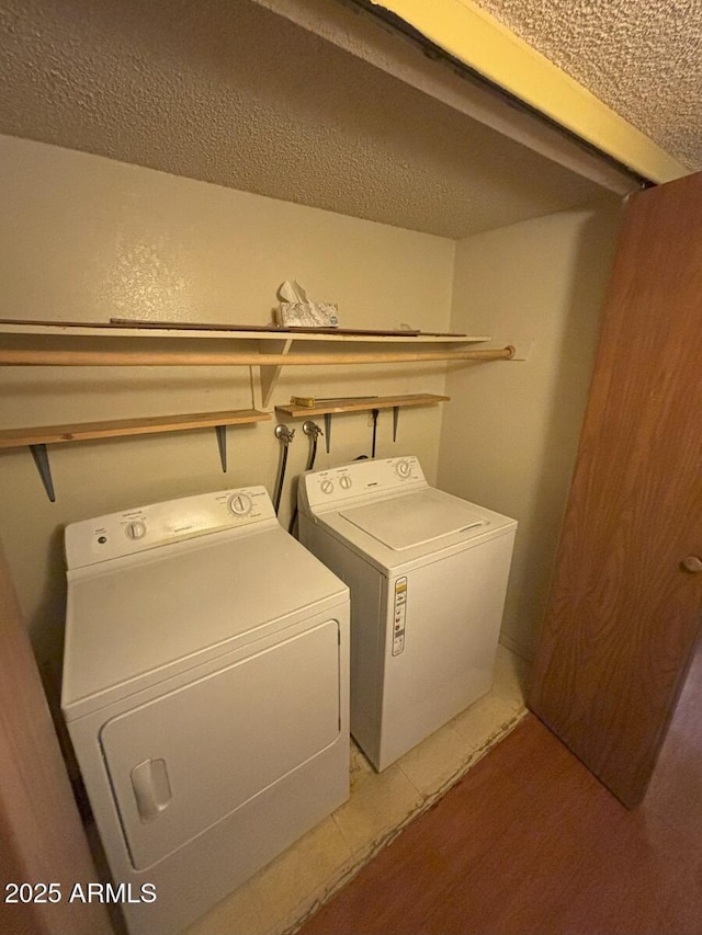 4910 E Foothills Dr, Sierra Vista, AZ 85635 - laundry room with separate washer and dryer and a textured ceiling