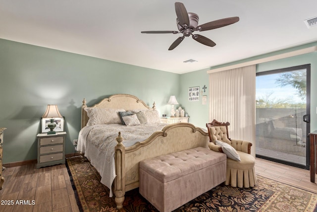 bedroom with light wood finished floors, visible vents, baseboards, a ceiling fan, and access to outside