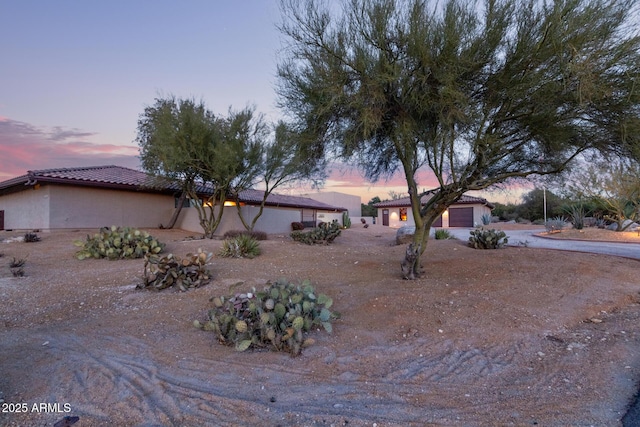 exterior space featuring driveway and an attached garage