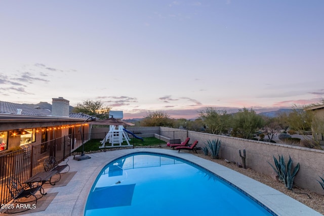 view of swimming pool featuring a fenced backyard and a fenced in pool