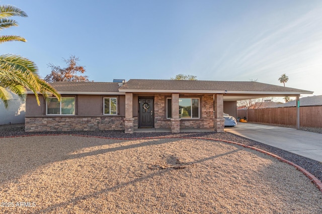 single story home featuring a carport