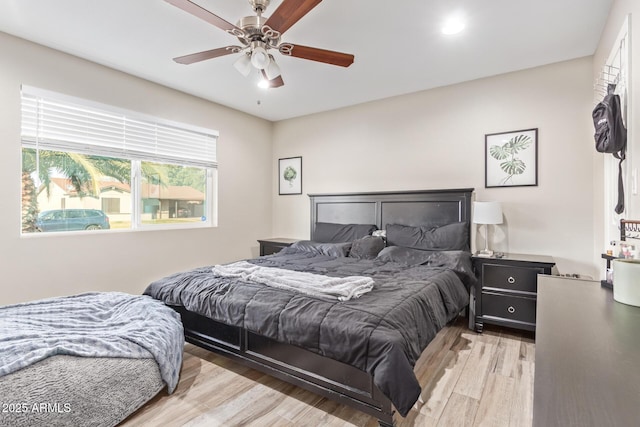 bedroom featuring ceiling fan and light wood-type flooring