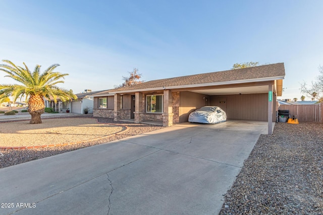 single story home featuring a carport