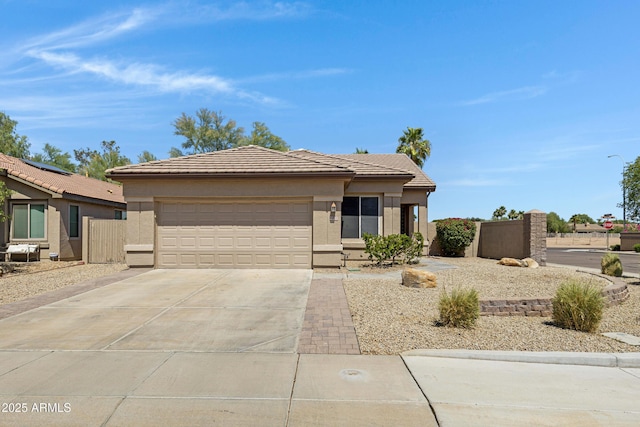 1821 S Navajo Way, Chandler, AZ 85286 - view of front of home with concrete driveway, a garage, a tiled roof, and stucco siding