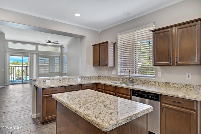 1821 S Navajo Way, Chandler, AZ 85286 - kitchen featuring stainless steel dishwasher, a peninsula, a ceiling fan, a kitchen island, and light stone counters