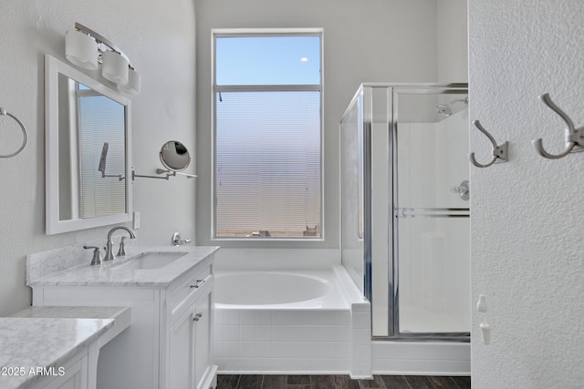 1821 S Navajo Way, Chandler, AZ 85286 - full bathroom with vanity, a shower stall, wood finished floors, and a garden tub