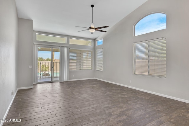 1821 S Navajo Way, Chandler, AZ 85286 - unfurnished room with dark wood finished floors, healthy amount of natural light, a ceiling fan, and a high ceiling