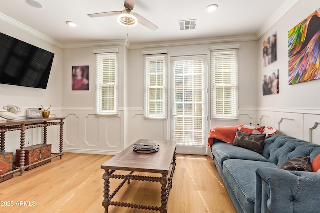 4419 N 24th Way, Phoenix, AZ 85016 - living room featuring wood finished floors, a ceiling fan, wainscoting, crown molding, and recessed lighting