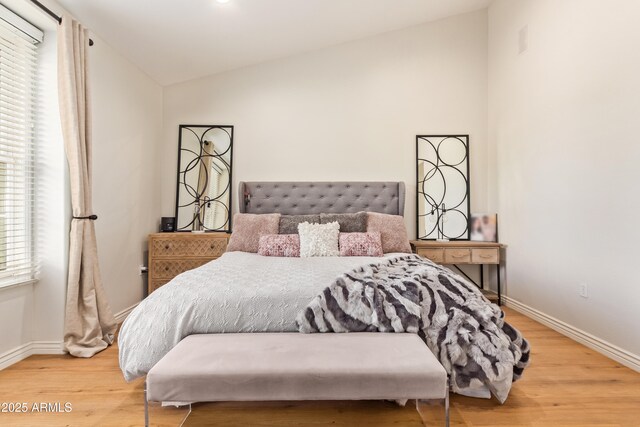 4419 N 24th Way, Phoenix, AZ 85016 - bedroom with vaulted ceiling, baseboards, and wood finished floors