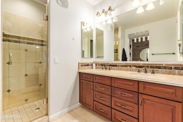 4419 N 24th Way, Phoenix, AZ 85016 - bathroom featuring tile patterned flooring, a shower stall, tasteful backsplash, double vanity, and baseboards