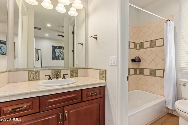 4419 N 24th Way, Phoenix, AZ 85016 - bathroom featuring toilet, vanity, and shower / bath combo with shower curtain