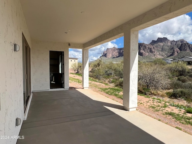 view of patio / terrace with a mountain view