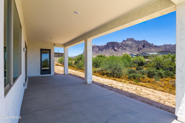 view of terrace with a mountain view