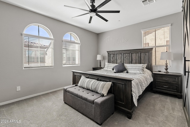 bedroom featuring light carpet and ceiling fan