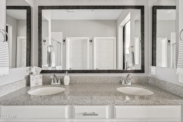 bathroom with vanity and an enclosed shower