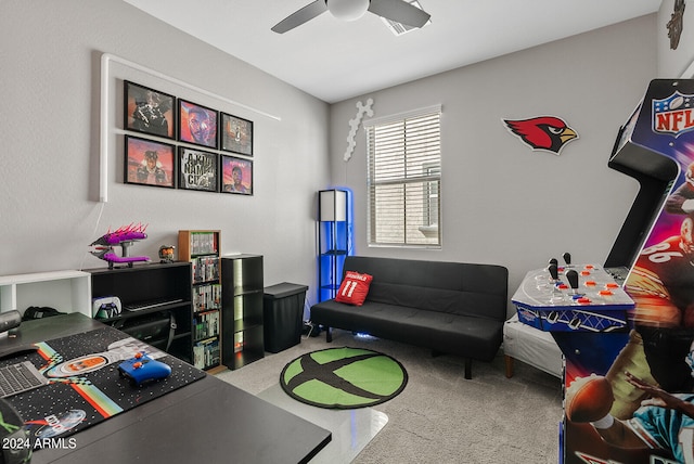 playroom with ceiling fan and carpet