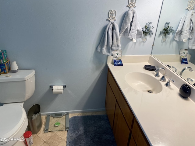 6637 E Culver St, Scottsdale, AZ 85257 - bathroom with toilet, vanity, tile patterned floors, and baseboards
