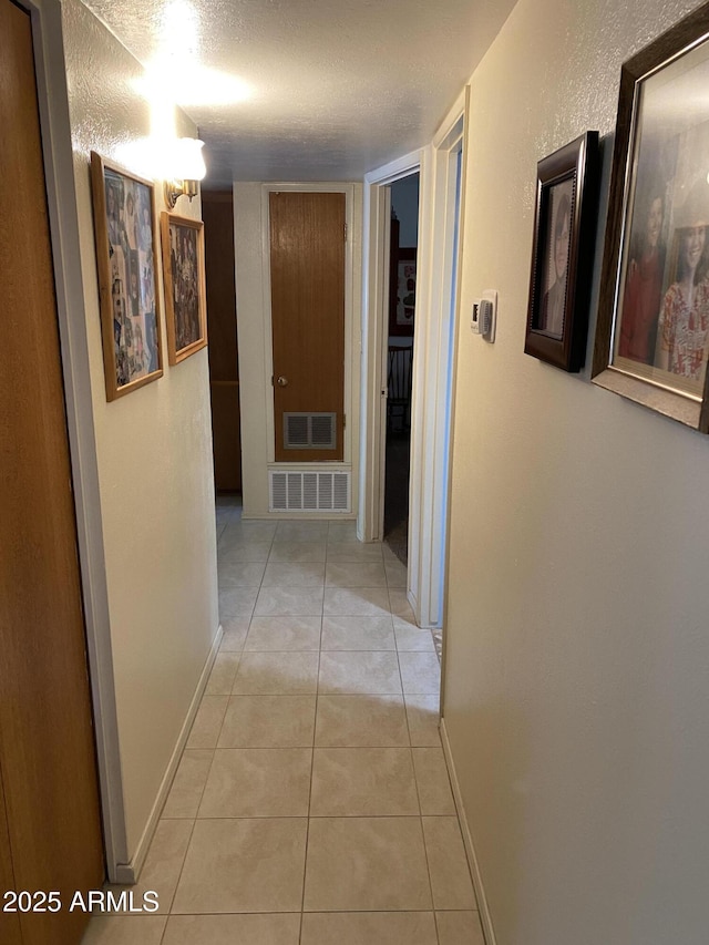 6637 E Culver St, Scottsdale, AZ 85257 - hall featuring baseboards and light tile patterned floors