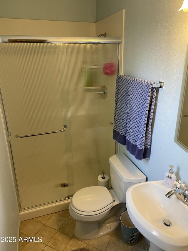 6637 E Culver St, Scottsdale, AZ 85257 - full bath with a sink, a stall shower, tile patterned flooring, and toilet
