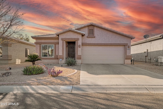 view of front of home with a garage