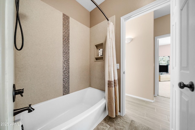 bathroom with shower / bath combination with curtain