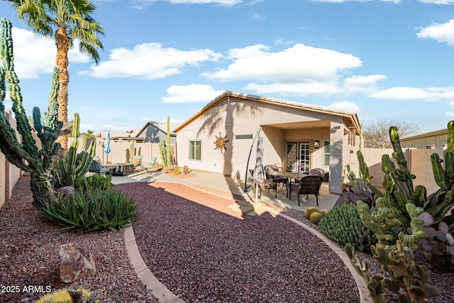 rear view of property featuring a patio