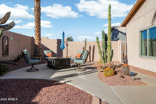 view of patio / terrace featuring a fire pit