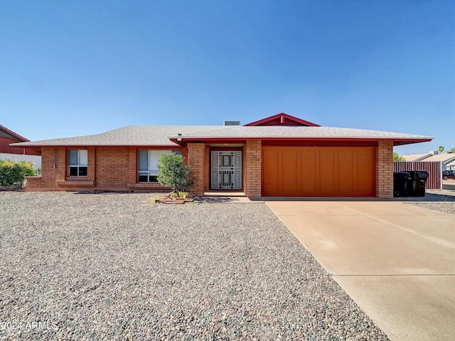 ranch-style home featuring a garage