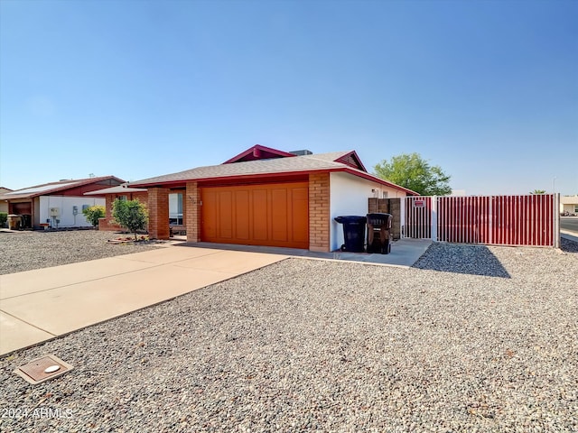 single story home featuring a garage