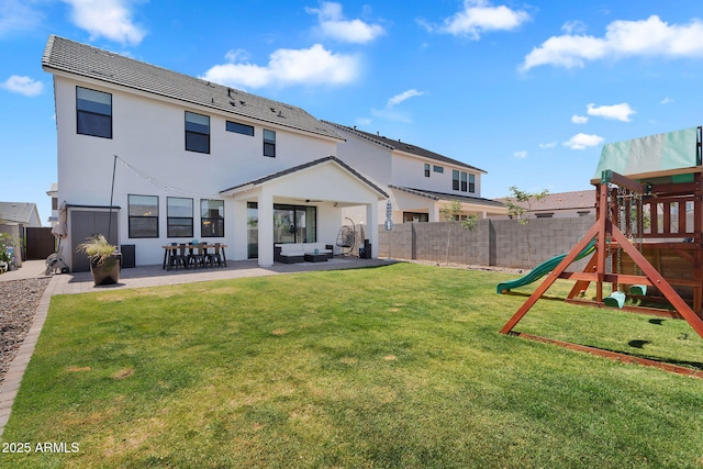 3592 W Cobalt Ct, San Tan Valley, AZ 85144 - rear view of property featuring a playground, outdoor lounge area, a patio, and stucco siding