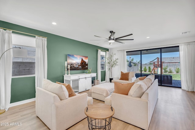 3592 W Cobalt Ct, San Tan Valley, AZ 85144 - living room with light wood-style floors, a ceiling fan, recessed lighting, and baseboards