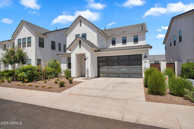 3592 W Cobalt Ct, San Tan Valley, AZ 85144 - view of front of property with an attached garage, driveway, stucco siding, and fence