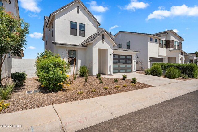 3592 W Cobalt Ct, San Tan Valley, AZ 85144 - view of front facade featuring stucco siding, driveway, an attached garage, a tiled roof, and fence