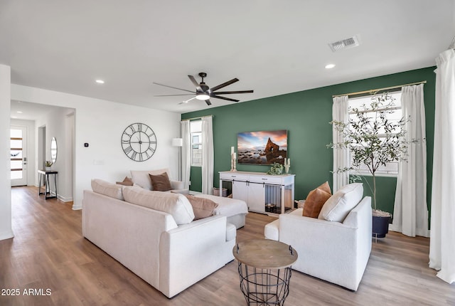 3592 W Cobalt Ct, San Tan Valley, AZ 85144 - living room featuring wood finished floors, a ceiling fan, healthy amount of natural light, recessed lighting, and baseboards
