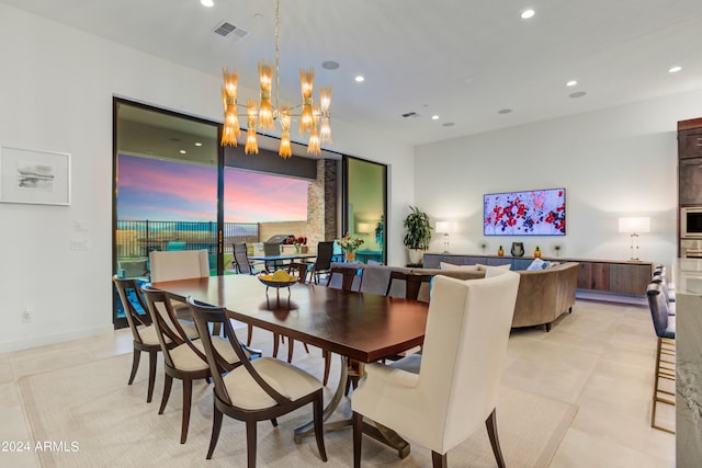 dining space with an inviting chandelier