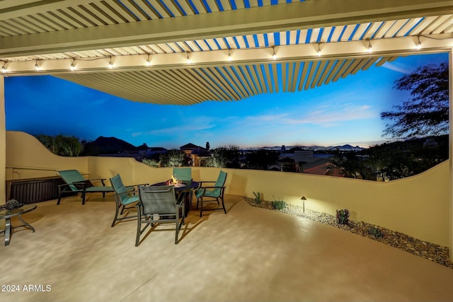 view of patio terrace at dusk